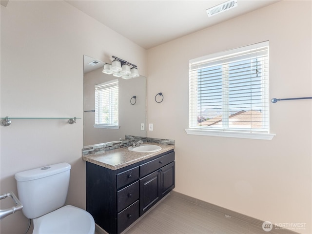 2422 Highland View Dr, East Wenatchee, WA 98802 - bathroom with vanity, toilet, and baseboards