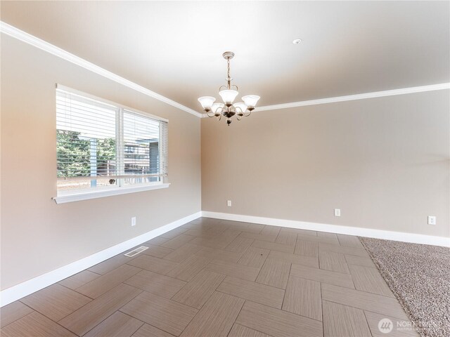 2422 Highland View Dr, East Wenatchee, WA 98802 - unfurnished room featuring baseboards, a chandelier, and crown molding