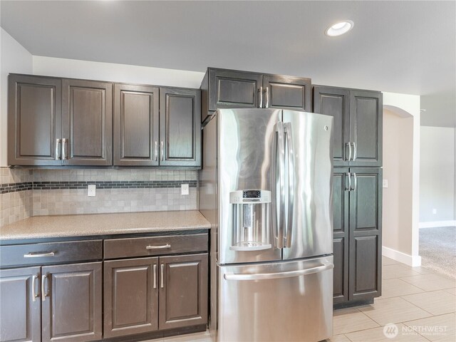 2422 Highland View Dr, East Wenatchee, WA 98802 - kitchen featuring stainless steel fridge with ice dispenser, tasteful backsplash, light countertops, baseboards, and recessed lighting