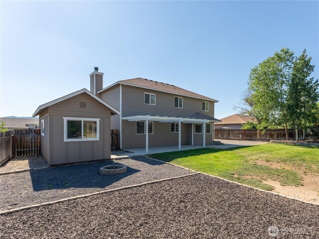 2422 Highland View Dr, East Wenatchee, WA 98802 - back of house featuring a patio, board and batten siding, a pergola, an outdoor fire pit, and a chimney
