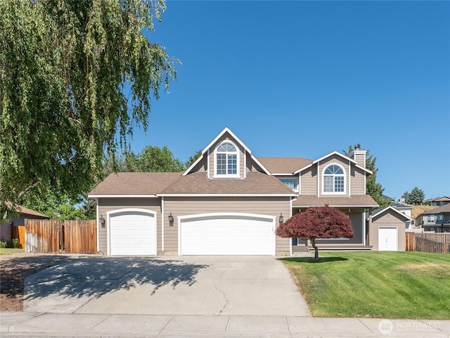 2422 Highland View Dr, East Wenatchee, WA 98802 - traditional-style house with a garage, driveway, and a chimney