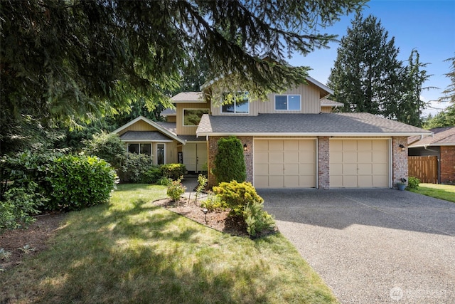 3905 109th Pl SE, Everett, WA 98208 - view of front facade featuring driveway, brick siding, and a garage