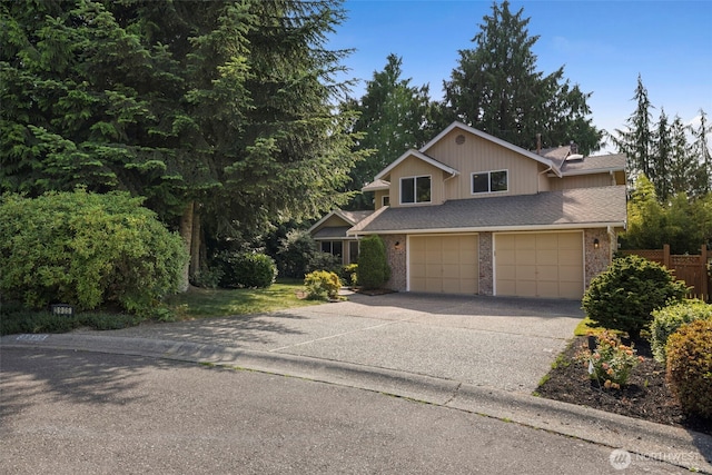 3905 109th Pl SE, Everett, WA 98208 - view of front of house featuring an attached garage, concrete driveway, and brick siding