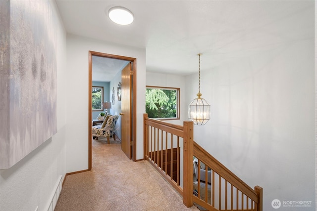 3905 109th Pl SE, Everett, WA 98208 - corridor with an upstairs landing, light colored carpet, and a chandelier
