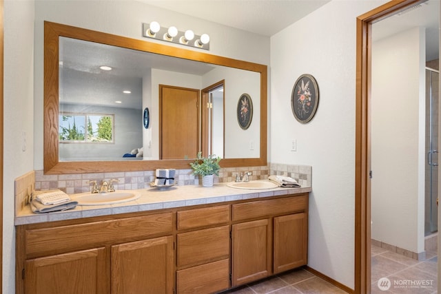 3905 109th Pl SE, Everett, WA 98208 - full bathroom featuring double vanity, a stall shower, decorative backsplash, and tile patterned floors