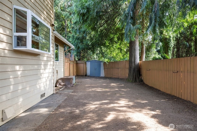 3905 109th Pl SE, Everett, WA 98208 - view of patio / terrace featuring a shed and asphalt driveway