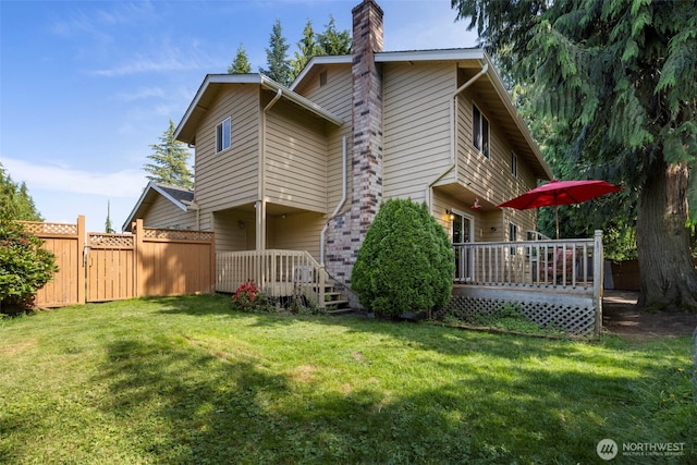 3905 109th Pl SE, Everett, WA 98208 - rear view of property with a chimney, a wooden deck, and a gate