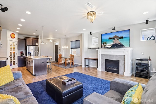 15323 NE 108th Way, Vancouver, WA 98682 - living area featuring light wood finished floors, recessed lighting, and a fireplace