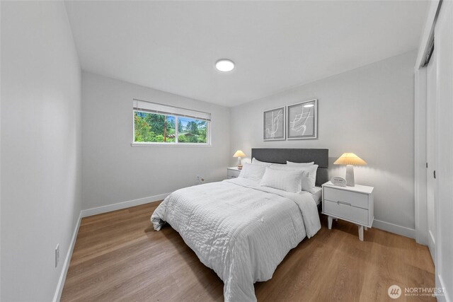 7713 NE 141st St, Kirkland, WA 98034 - bedroom featuring a closet and wood finished floors
