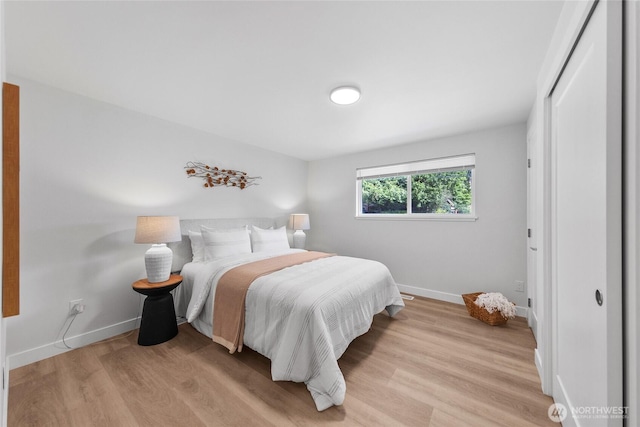 7713 NE 141st St, Kirkland, WA 98034 - bedroom with light wood-type flooring and baseboards
