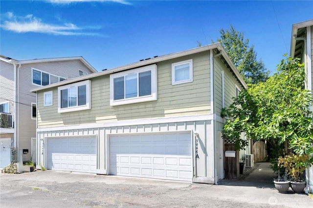 3446A 34th Ave W, Seattle, WA 98199 - view of front of home with an attached garage and driveway