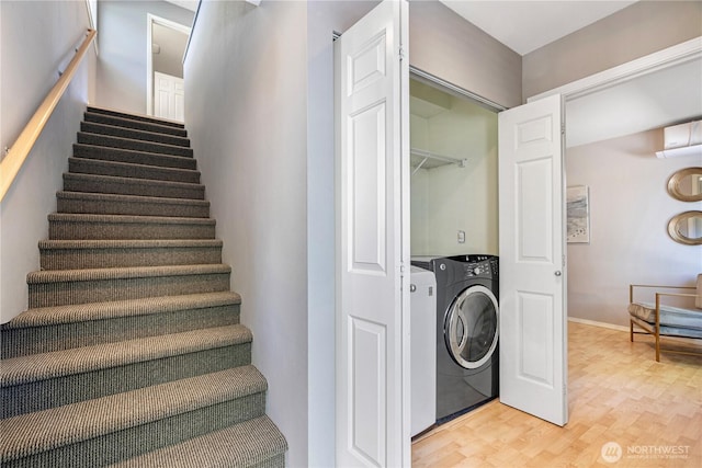 3446A 34th Ave W, Seattle, WA 98199 - stairs featuring washer / clothes dryer and wood finished floors