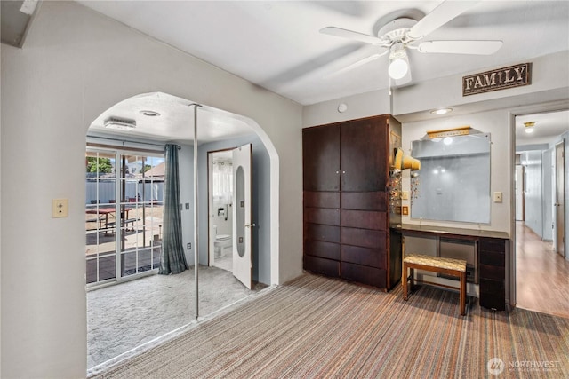 1300 Monitor Ave, Wenatchee, WA 98801 - interior space with arched walkways, carpet flooring, and a ceiling fan