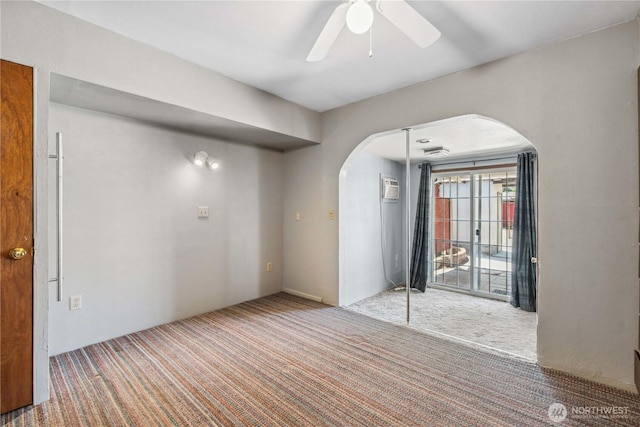 1300 Monitor Ave, Wenatchee, WA 98801 - empty room featuring arched walkways, carpet, and a ceiling fan