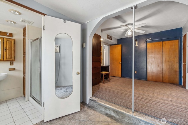1300 Monitor Ave, Wenatchee, WA 98801 - bathroom featuring a ceiling fan, a shower stall, and tile patterned floors