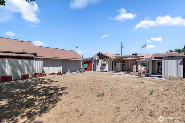 1300 Monitor Ave, Wenatchee, WA 98801 - back of property featuring a patio area and board and batten siding