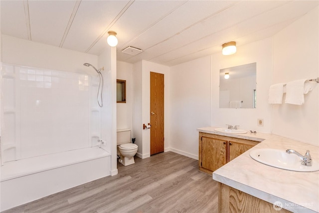 24443 Wicker Rd Unit 16, Sedro Woolley, WA 98284 - bathroom featuring vanity, washtub / shower combination, and wood finished floors