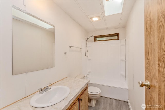 24443 Wicker Rd Unit 16, Sedro Woolley, WA 98284 - full bathroom with vanity, shower / tub combination, and wood finished floors