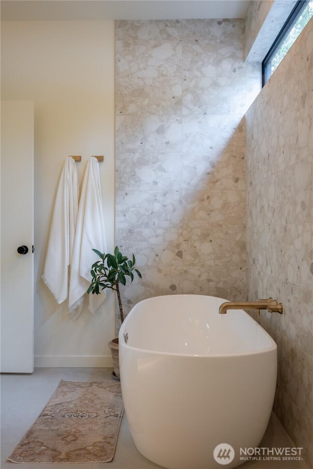 580 Park Ave NE, Bainbridge Island, WA 98110 - full bathroom featuring a soaking tub and tile walls