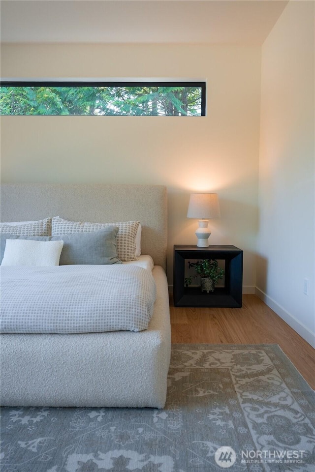 580 Park Ave NE, Bainbridge Island, WA 98110 - bedroom featuring baseboards and wood finished floors