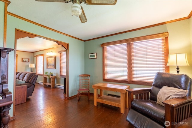 50 Blackberry St, Forks, WA 98331 - sitting room featuring a ceiling fan, hardwood / wood-style flooring, ornamental molding, arched walkways, and a baseboard heating unit