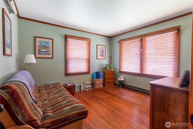 50 Blackberry St, Forks, WA 98331 - home office featuring baseboard heating, wood finished floors, ornamental molding, and healthy amount of natural light