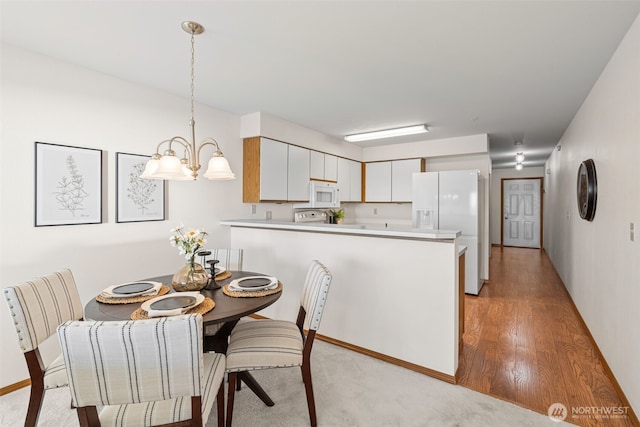 8026 Birch Bay Dr Unit 216, Blaine, WA 98230 - dining space featuring baseboards and light wood finished floors