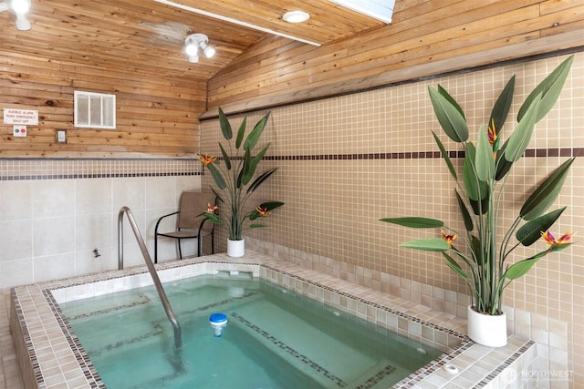 10742 Glen Acres Dr S Unit T-27, Seattle, WA 98168 - view of pool with an in-ground hot tub