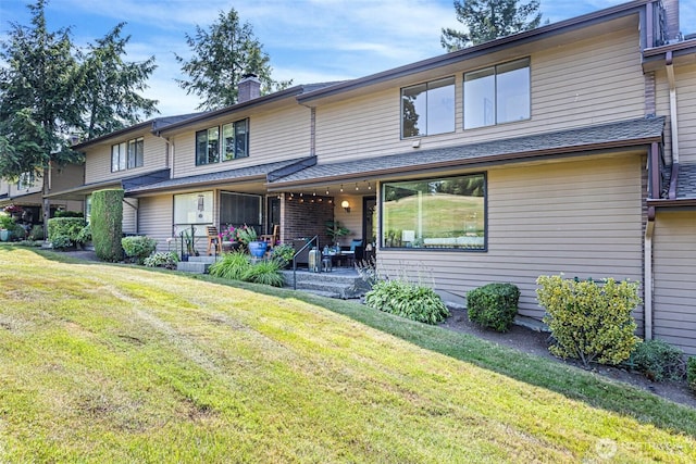 10742 Glen Acres Dr S Unit T-27, Seattle, WA 98168 - view of front of home featuring a front lawn and a chimney