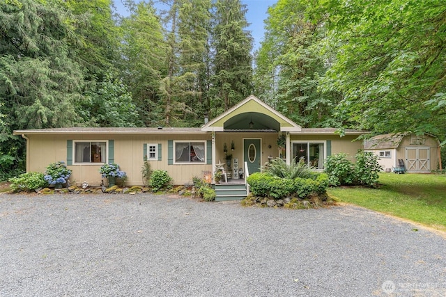18330 Jim Creek Rd, Arlington, WA 98223 - single story home with a shed, covered porch, and a front yard