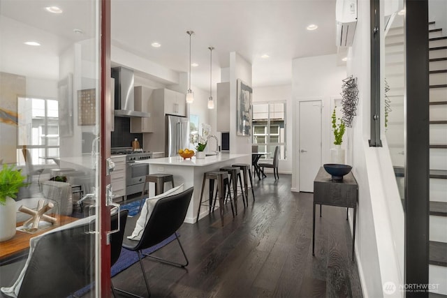 111 Martin Luther King Jr Way, Seattle, WA 98122 - dining space featuring dark wood-type flooring, a wall mounted air conditioner, and recessed lighting