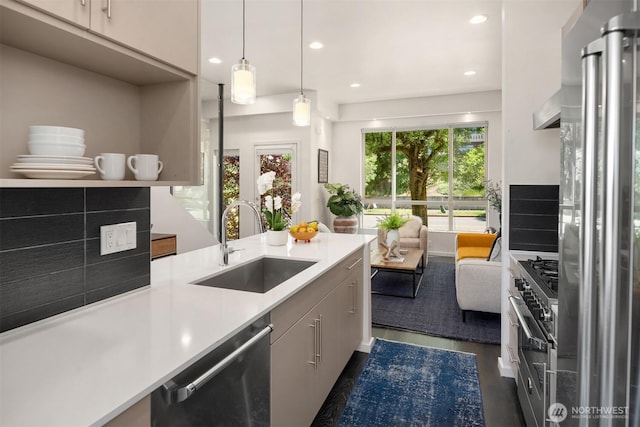 111 Martin Luther King Jr Way, Seattle, WA 98122 - kitchen featuring appliances with stainless steel finishes, light countertops, recessed lighting, pendant lighting, and dark wood-style flooring