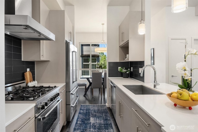 111 Martin Luther King Jr Way, Seattle, WA 98122 - kitchen with stainless steel appliances, wall chimney exhaust hood, light countertops, gray cabinetry, and backsplash
