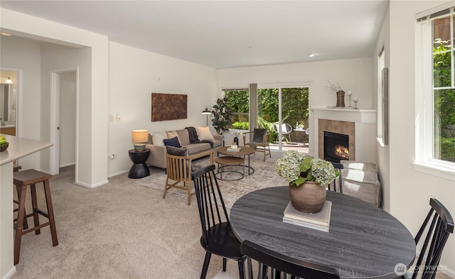5100 Talbot Pl S Unit F, Renton, WA 98055 - dining room with plenty of natural light, a fireplace, and light colored carpet