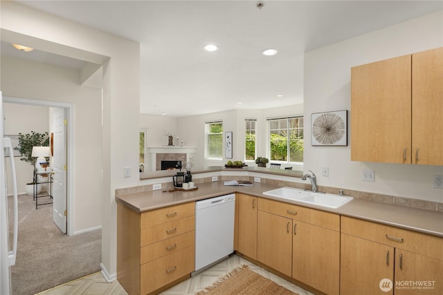 5100 Talbot Pl S Unit F, Renton, WA 98055 - kitchen featuring white dishwasher, a fireplace, recessed lighting, light countertops, and a peninsula