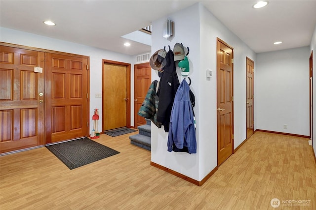 8120 Gordon Rd, Concrete, WA 98237 - foyer entrance featuring light wood-style floors, baseboards, recessed lighting, and stairway