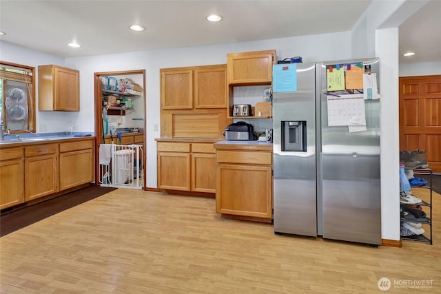 8120 Gordon Rd, Concrete, WA 98237 - kitchen featuring stainless steel fridge with ice dispenser, light wood finished floors, recessed lighting, and light countertops