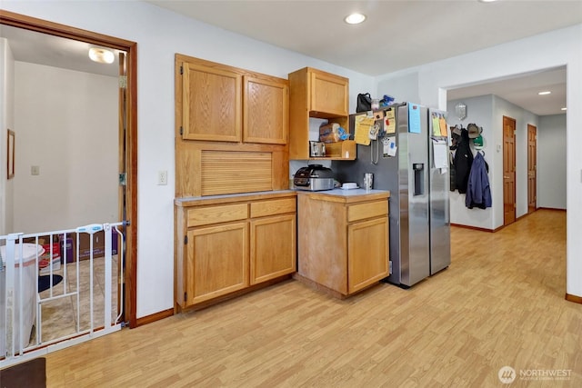 8120 Gordon Rd, Concrete, WA 98237 - kitchen with light wood finished floors, light countertops, stainless steel fridge, recessed lighting, and baseboards