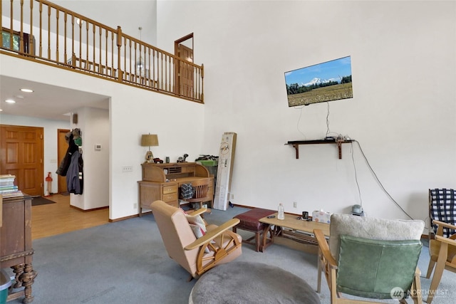 8120 Gordon Rd, Concrete, WA 98237 - living area featuring a high ceiling, baseboards, carpet flooring, and recessed lighting