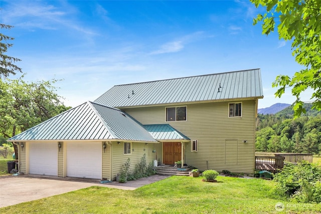 8120 Gordon Rd, Concrete, WA 98237 - view of front facade featuring a front yard, metal roof, a standing seam roof, and a detached garage