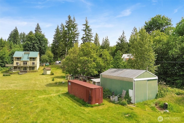 8120 Gordon Rd, Concrete, WA 98237 - view of green lawn featuring a pole building and an outdoor structure