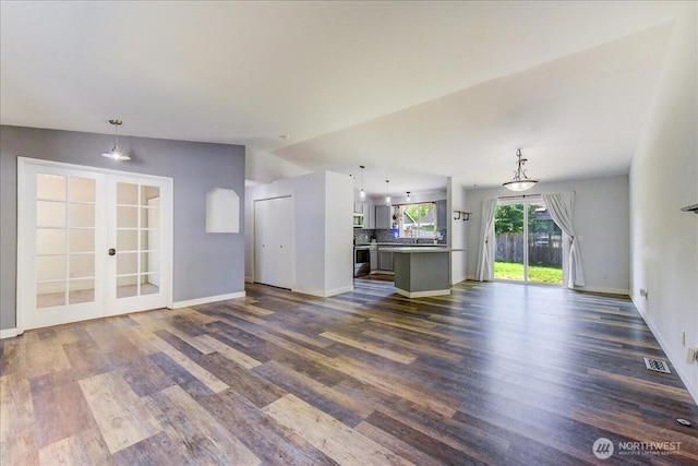 7116 200th Street Ct E, Spanaway, WA 98387 - unfurnished living room featuring dark wood-type flooring and french doors