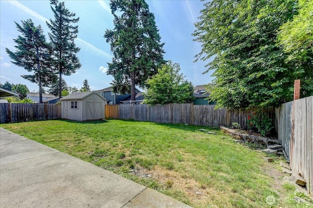 7116 200th Street Ct E, Spanaway, WA 98387 - fenced backyard featuring a storage shed