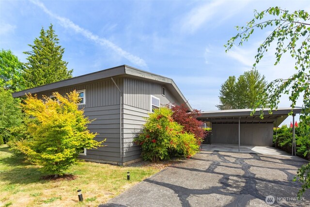 6151 S 125th St, Seattle, WA 98178 - view of home's exterior with driveway and a detached carport