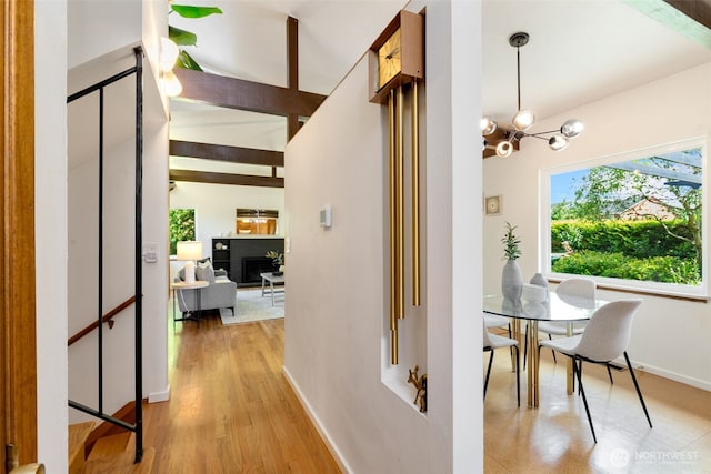 6151 S 125th St, Seattle, WA 98178 - corridor with a chandelier and light wood-style flooring