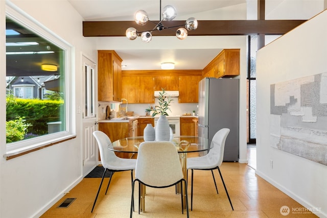 6151 S 125th St, Seattle, WA 98178 - dining space featuring a chandelier and baseboards