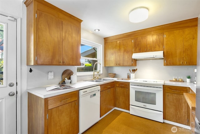 6151 S 125th St, Seattle, WA 98178 - kitchen featuring white appliances, under cabinet range hood, healthy amount of natural light, and light countertops