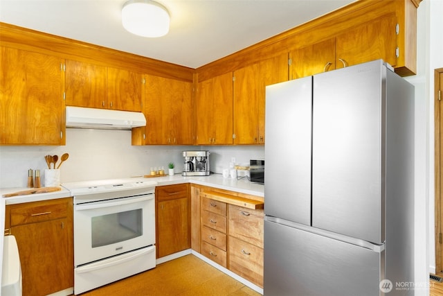 6151 S 125th St, Seattle, WA 98178 - kitchen featuring freestanding refrigerator, under cabinet range hood, electric stove, light countertops, and brown cabinets