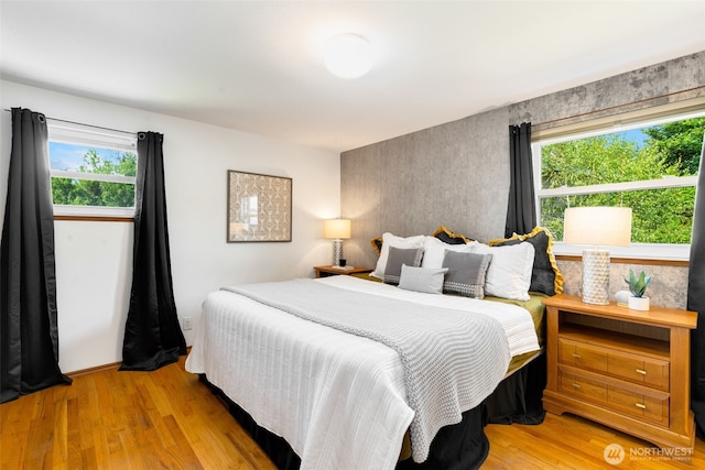6151 S 125th St, Seattle, WA 98178 - bedroom with multiple windows and wood finished floors