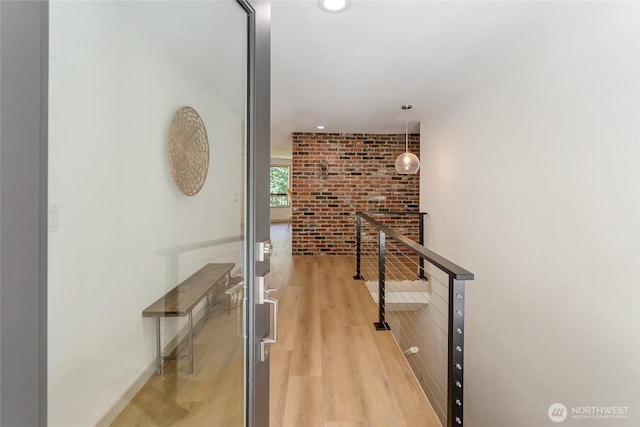 3327 170th Ave E, Lake Tapps, WA 98391 - hall with light wood-style floors, brick wall, recessed lighting, and an upstairs landing